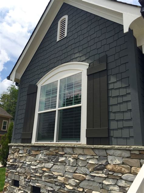 houses with grey metal roofs|grey houses with black shutters.